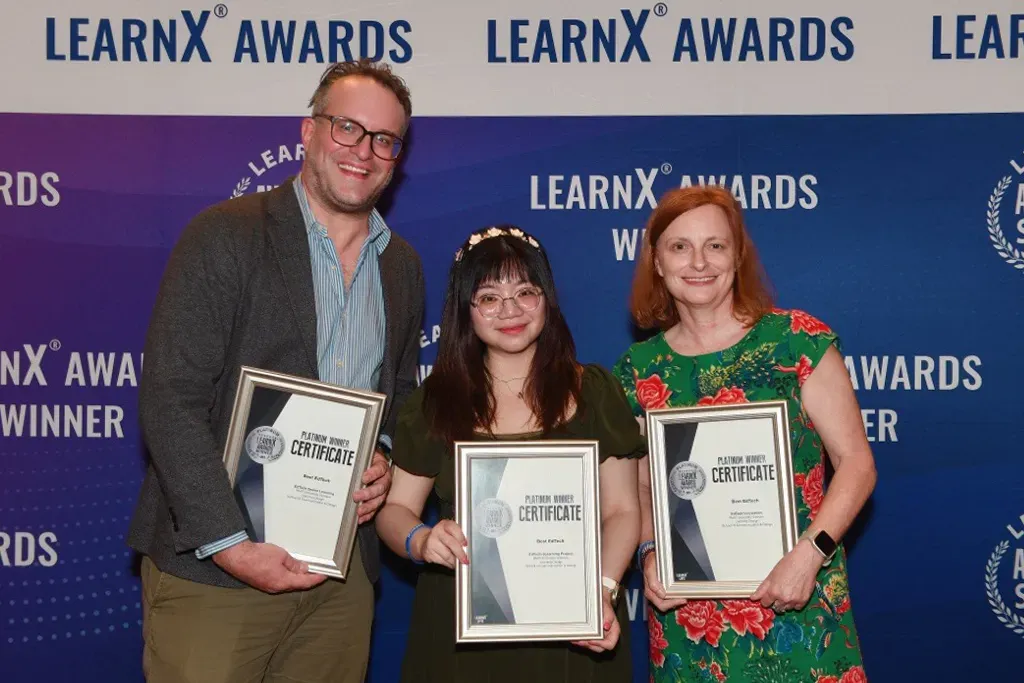 three members of RMIT accepting the Platinum LearnX Awards